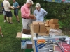 Dave and Gary examining boxes and tool sale items.